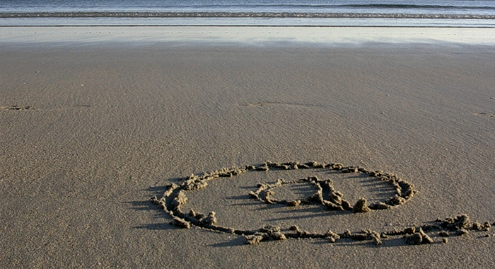 e-mailteken op het strand